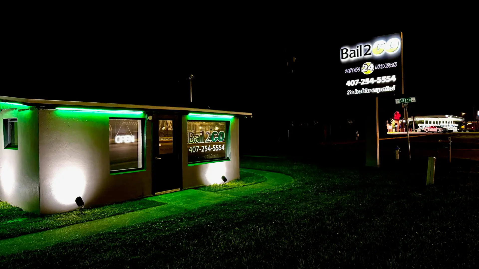 Bail 2 GO Orlando office at night, lit up and open 24/7, at 3800 S John Young Pkwy across from the Orange County Jail